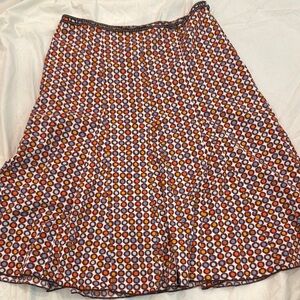 Vibrant Orange and Black Patterned Midi Skirt